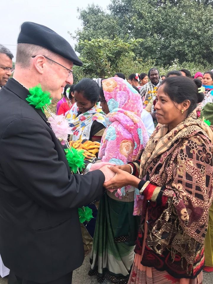 People greet Bishop McKnight in Kunkuri.